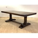A large oak refectory style dining table of 18th century design, the thick panelled top over two