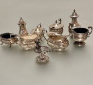A miniature Chester silver half lobbed milk jug and two handled sugar basin and a Birmingham