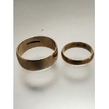 A 9ct gold wedding band, size u/v, weighs 5.45 grammes, and an 18ct gold wedding band, size j,