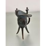 A bronze 19thc Chinese archaic style bronze Jue libation vessel with twin post to top and