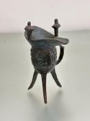 A bronze 19thc Chinese archaic style bronze Jue libation vessel with twin post to top and