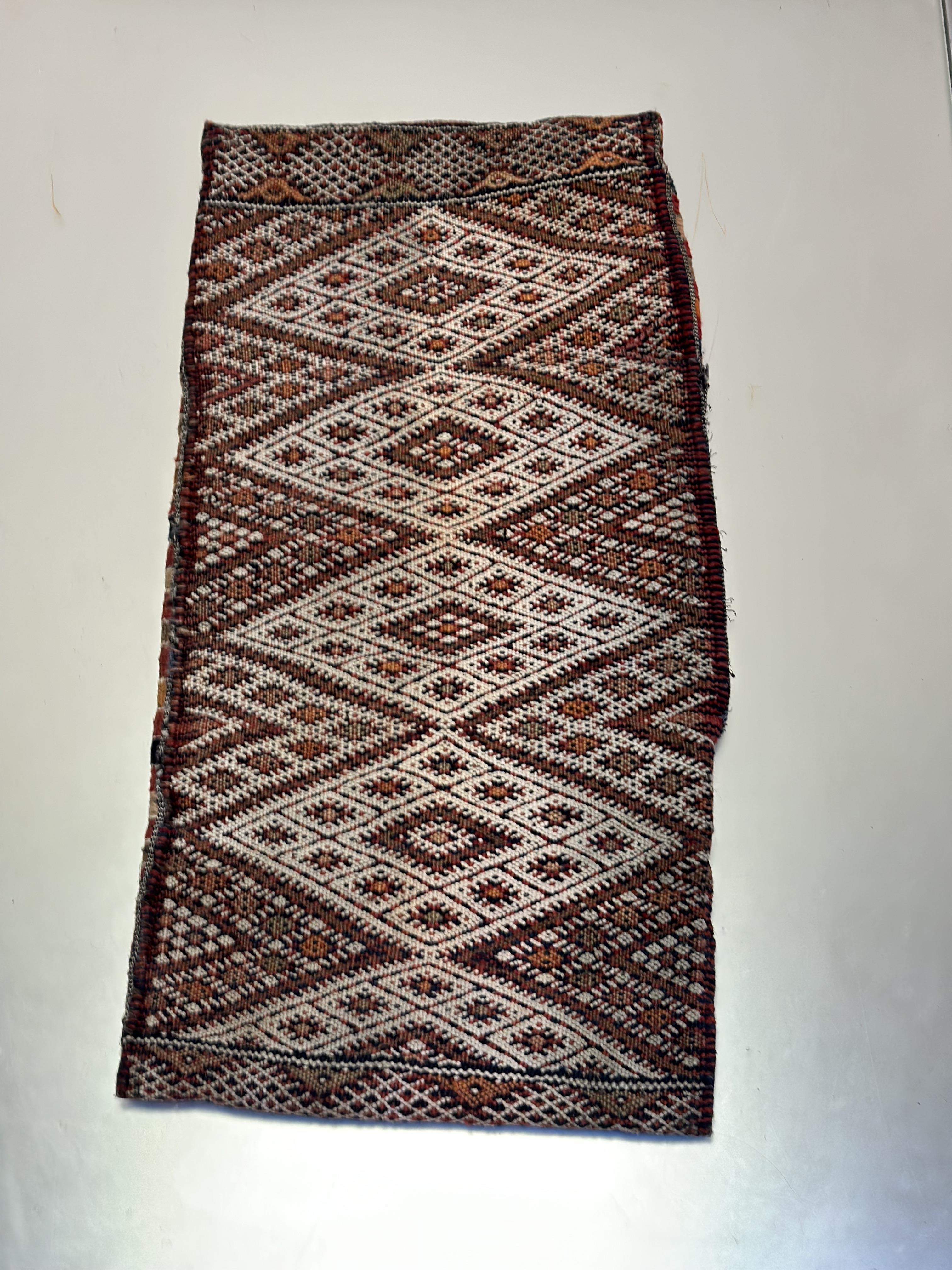 A Caucasian Nomadic tribal Bag Face rug with four diamond shaped panels enclosed within stylised