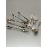 A pair of Epns mother of pearl handled pickle forks, Sheffield silver pair of sugar tongs,