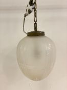 An Edwardian style ceiling pendant light fitting, with brass rose and chair supporting an etched and