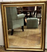 A 19thc rectangular gilt framed composition wall mirror with later mirrored glass plate, (h 98cm x