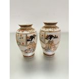 A pair of modern Japanese kaga baluster vases decorated with figures playing musical instruments