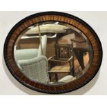 A 1920s mahogany and ebony bead and rope pattern bordered wall mirror with bevelled glass plate, (