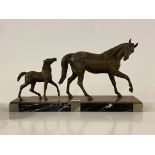 An Art Deco style hollow cast bronze figural group of horse and foal, ona stepped marble and onyx