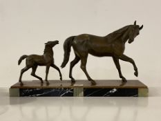 An Art Deco style hollow cast bronze figural group of horse and foal, ona stepped marble and onyx