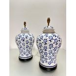 A pair of Chinese blue and white baluster ginger jar style vase lamps decorated with floral design