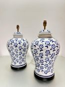 A pair of Chinese blue and white baluster ginger jar style vase lamps decorated with floral design