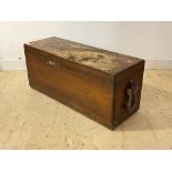 A late 19th century stained varnished walnut coffer, the hinged top over waxed rope carry handle