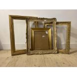 A group of four gilt composition picture or mirror frames, largest aperture 49cm x 59cm