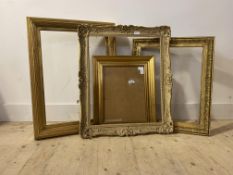 A group of four gilt composition picture or mirror frames, largest aperture 49cm x 59cm