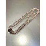 A cultured two strand pearl necklace, (each pearl d 0.3cm approximately) with 9ct gold seed pearl