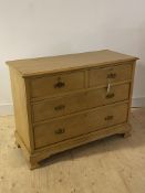 An early 20th century satin walnut chest, fitted with two short and two long graduated drawers