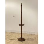 A turned mahogany stand light, with open shelf and stepped circular base H166cm