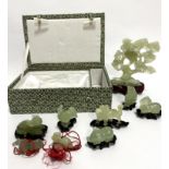 A collection of modern Chinese celadon jadeite carved animal figures including dragon, cockerel,