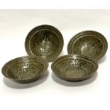 A set of four green speckled and brown iron oxide shallow bowls with ribbed border, unmarked, (5cm x