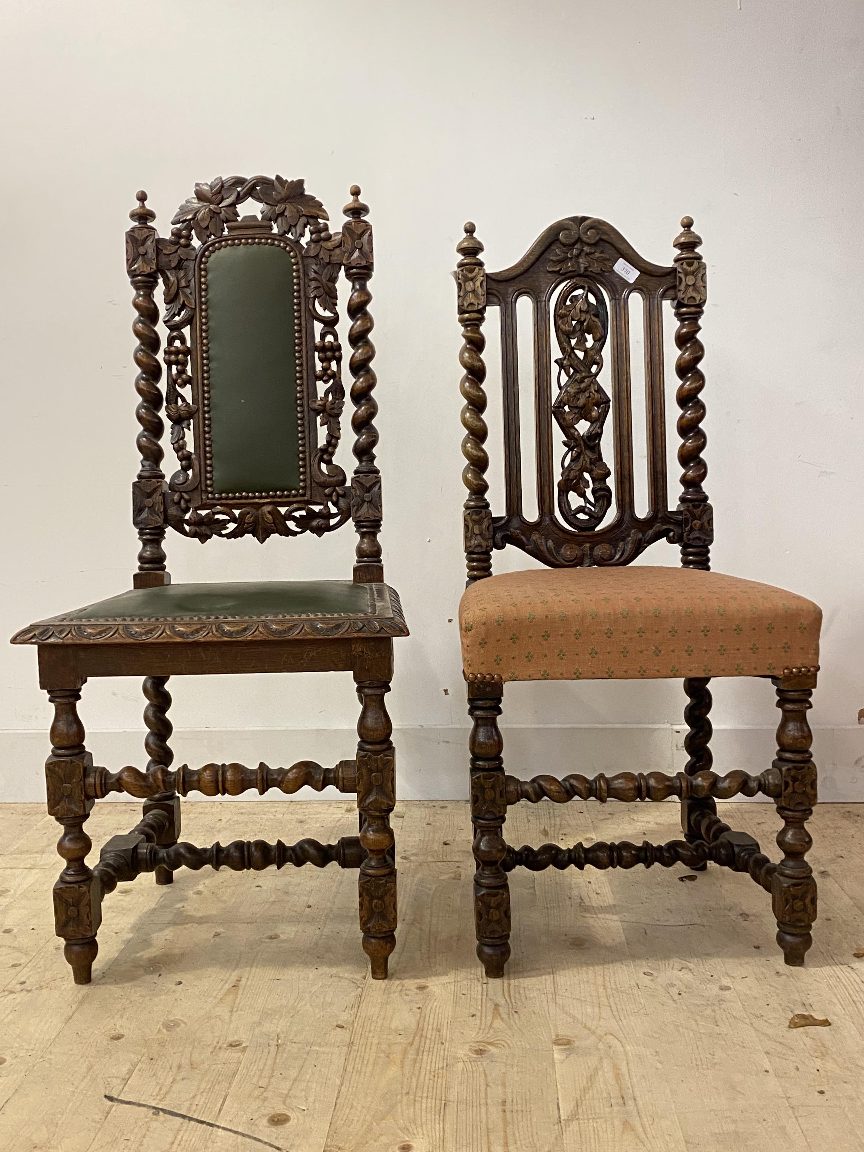 A matched pair of 19th century Carolean style oak side chairs, each with floral carving and spiral