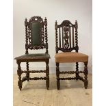 A matched pair of 19th century Carolean style oak side chairs, each with floral carving and spiral