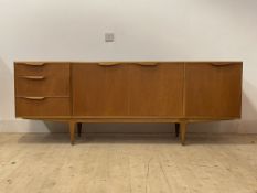 McIntosh, A mid century teak sideboard, with a fall front cocktail cupboard, twin cupboard and three