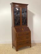 An Edwardian inlaid mahogany bureau bookcase, the top with two astragal glazed doors enclosing two