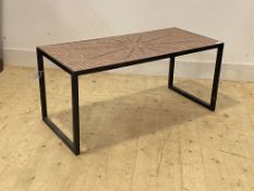 A modern tile top coffee table, raised on black metal square section supports, H45cm, W102cm D51cm