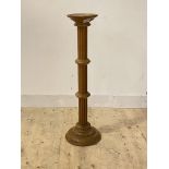 A turned fluted beech torchere, H98cm
