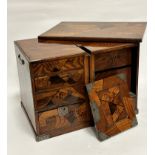 A late 19thc Japanese inlaid mixed wood two section chest, the lift off top with inlaid panels in
