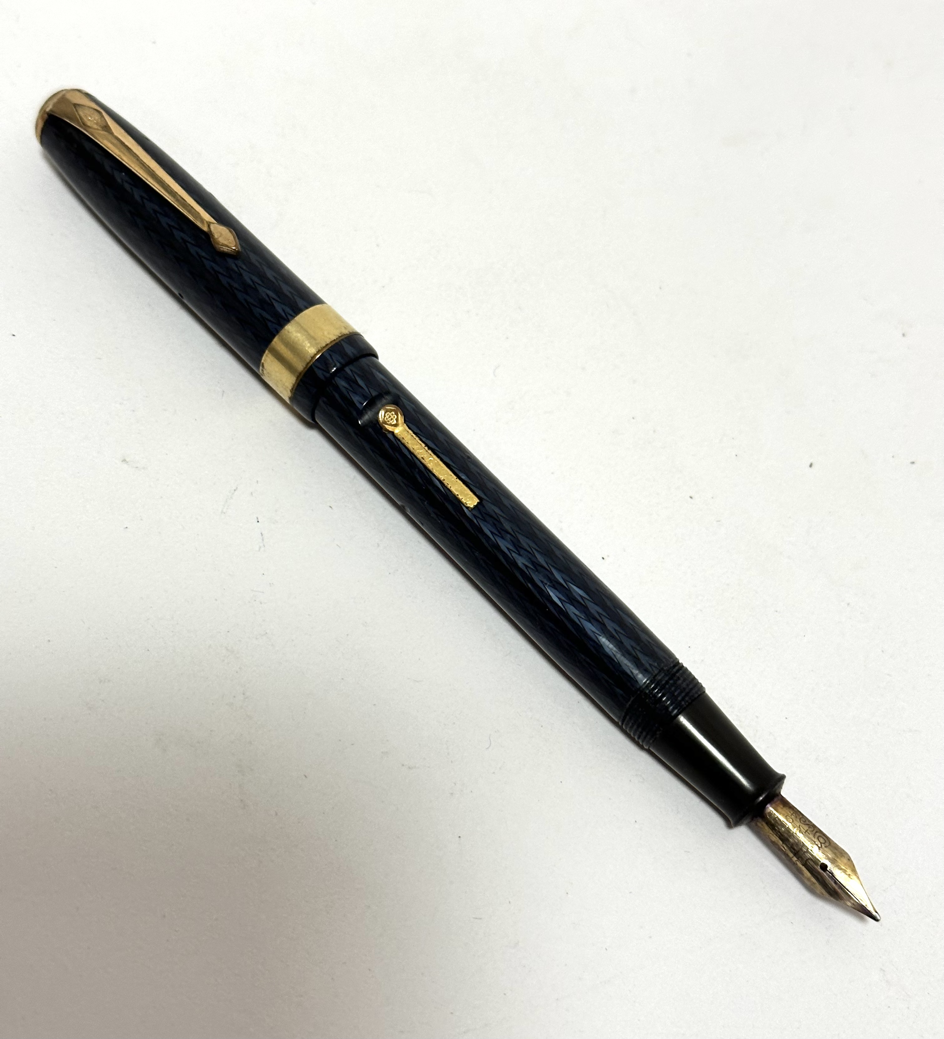 A Parker fountain pen with blue Guilloche style case, signs of rubbing etc