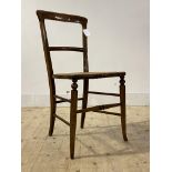 An Edwardian stained beech side chair, with rail back, cane seat and turned supports and stretchers,