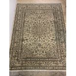 A fine Hand knotted carpet from the kashan region, the ivory field with medallion, spandrels and