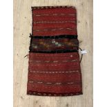 A Persian hand knotted flat weave saddle bag, 118cm x 60cm