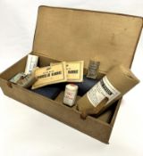 A WWI officers military first aid kit including Boots triangular grey bandage, bandages, fine