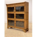 A Minty oak sectional stacking bookcase, three height with six glazed doors, H102cm, W90cm, D27cm