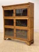 A Minty oak sectional stacking bookcase, three height with six glazed doors, H102cm, W90cm, D27cm