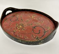 A bentwood oval two handled tray, decorated with handpainted floral and C scroll sprays, (3cm x 36cm