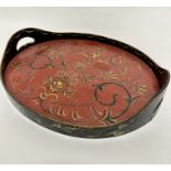 A bentwood oval two handled tray, decorated with handpainted floral and C scroll sprays, (3cm x 36cm