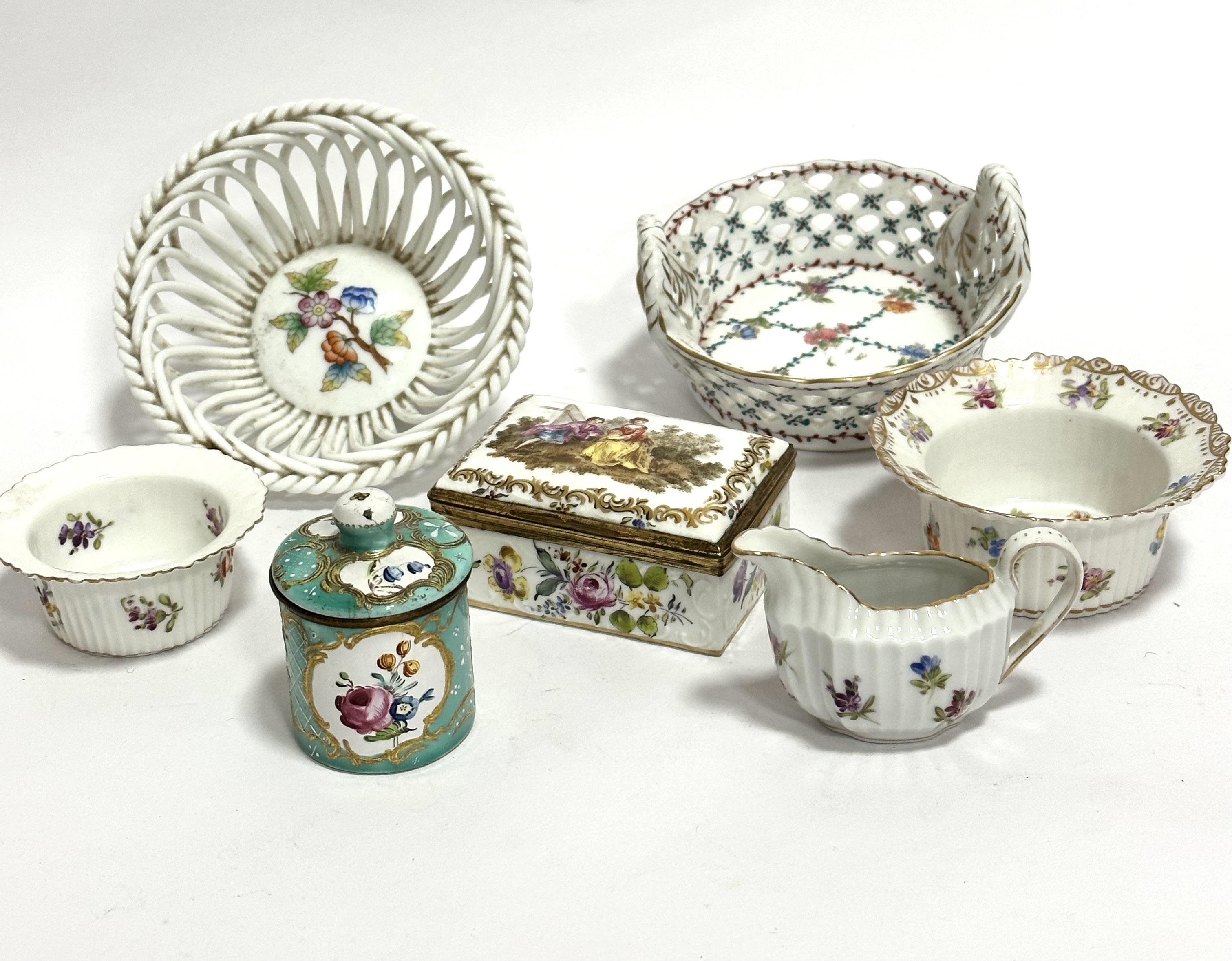 A French enamelled circular pot with floral sprays, with gilt and jade green reserves, gilt cross