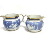 A pair of Victorian china moulded jugs decorated with Jasperware style sprigged Roman style scenes