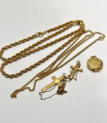 A 9ct gold crucifix on trace link chain and another 9ct gold engraved crucifix, 3.7g, two gilt metal