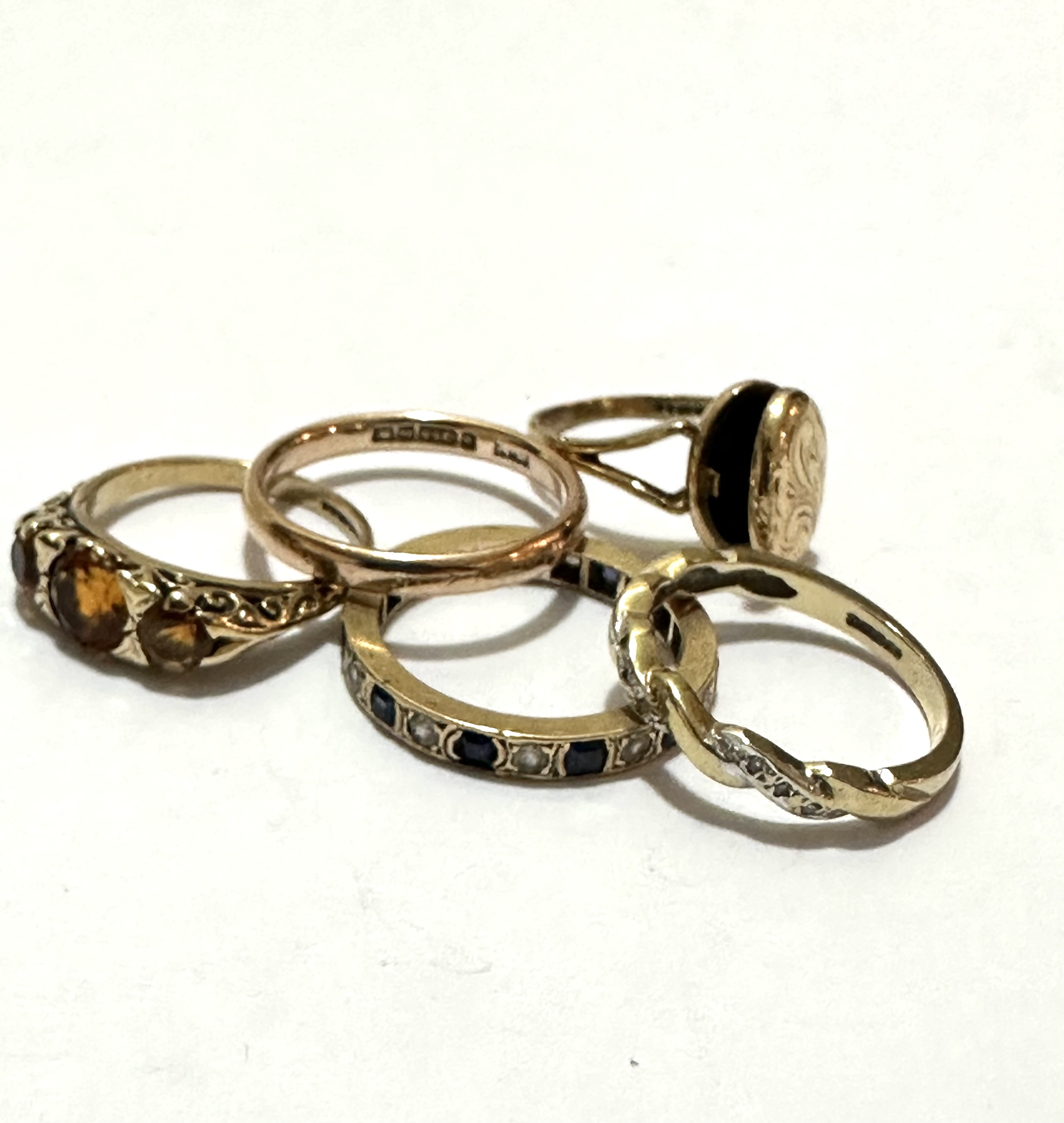 A 9ct gold scrolling ring set nine various diamond points, a yellow metal blue and white sapphire