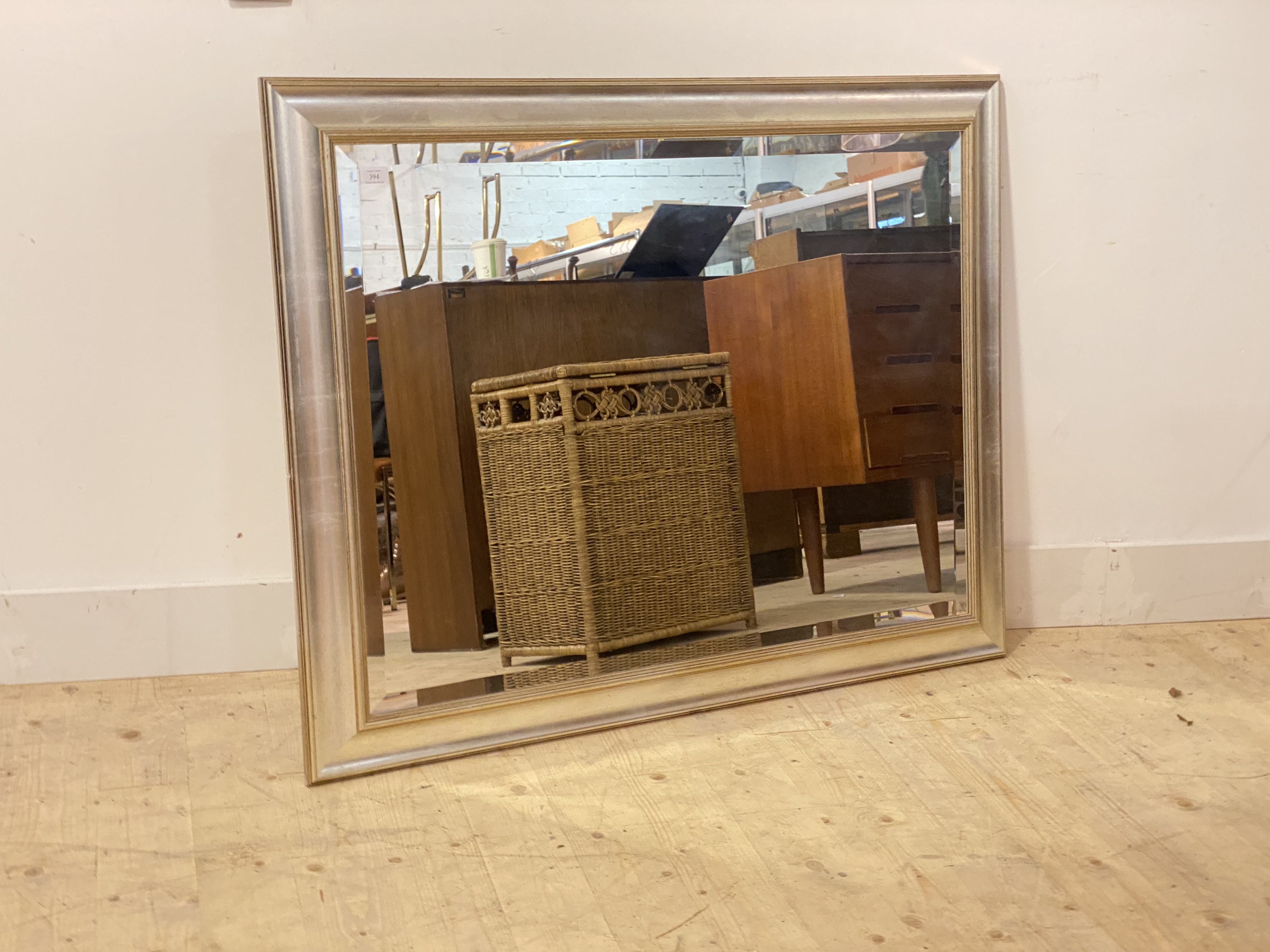 A silvered and gilt framed wall mirror with bevel edge 92cm x 118cm