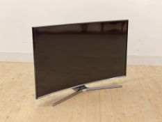 A Samsung curved flat screen 47" TV, with power cable and remote
