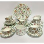A Minton Haddon Hall pattern part piece tea set with floral sprays and gilt border including seven