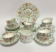 A Minton Haddon Hall pattern part piece tea set with floral sprays and gilt border including seven