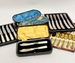 A set of six stainless steel mother of pearl handled tea knives in fitted case, a set of six handled