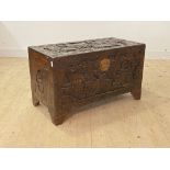 A mid 20th century Chinese carved camphor wood blanket box, the hinged lid revealing plain interior,