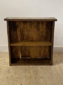 An early 20th century oak open bookcase, with floral carved bands and one adjustable shelf, H82cm,